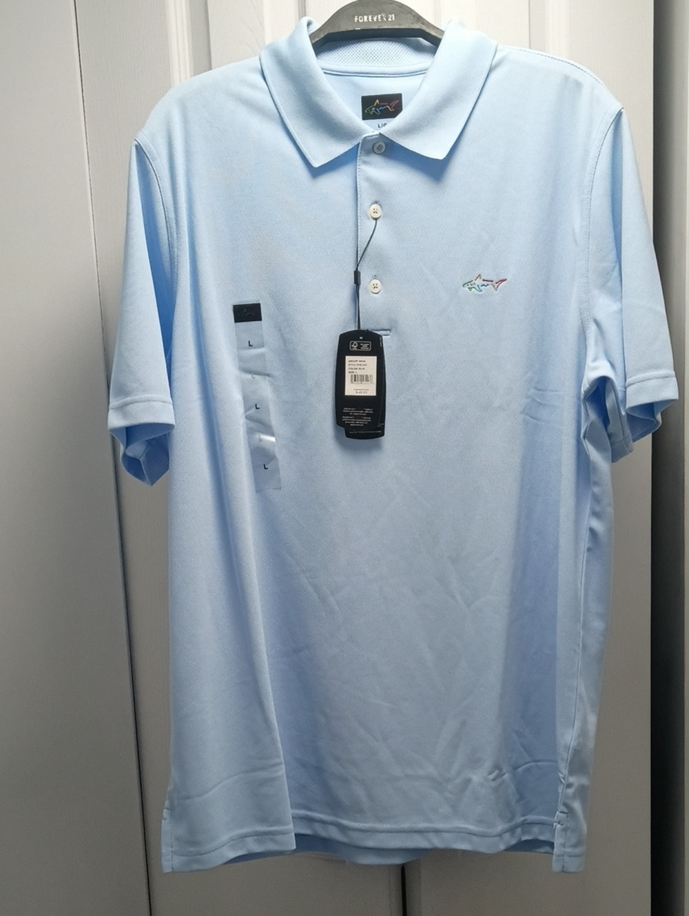 Greg Norman Collection Light Blue Polo with Shark Embroidery